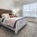 a bedroom with a bed and a chair
