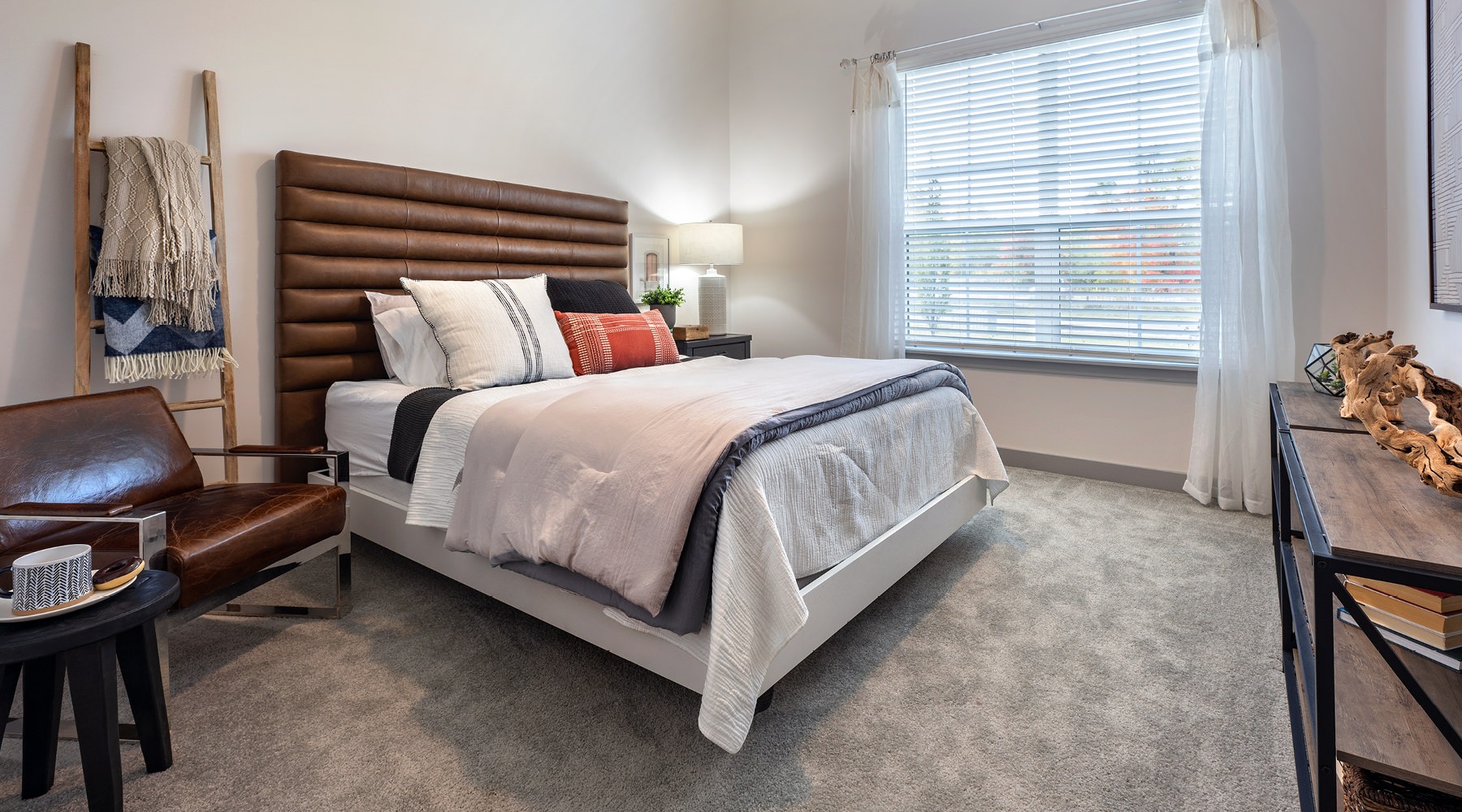 Welcome Home Bedroom with natural lighting and high ceilings