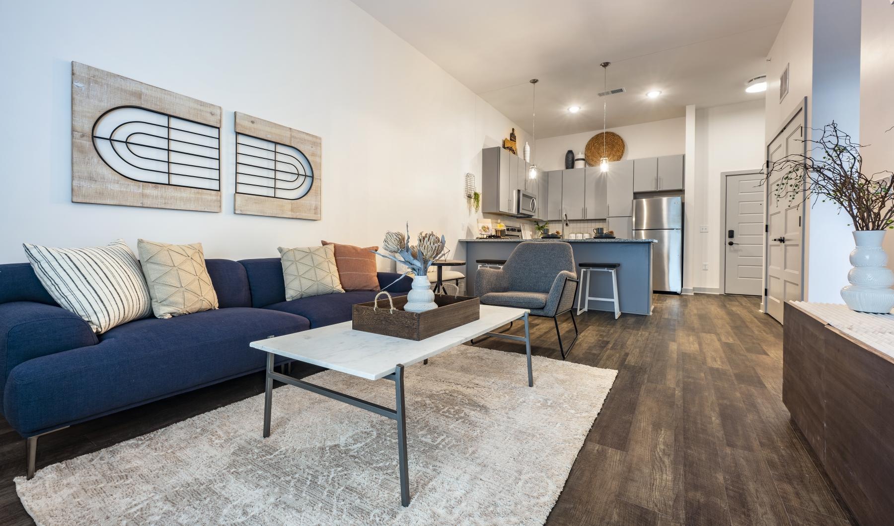 Settle into comfort at The Banks a living room with a blue couch