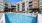 a swimming pool in front of a building