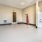a room with a white floor and a red door