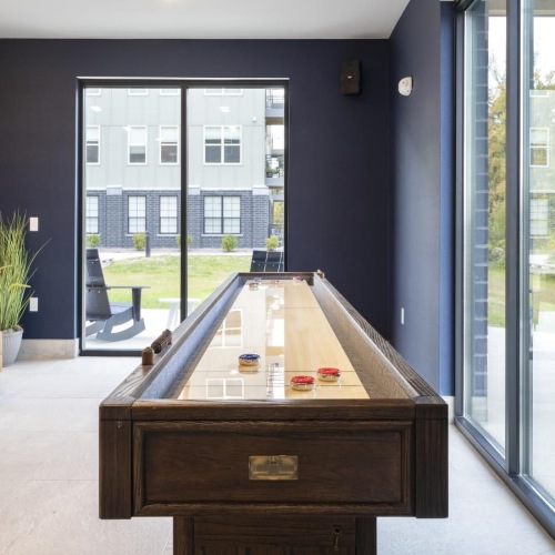 Take advantage of all The Banks has to offer a room with a fireplace and a table